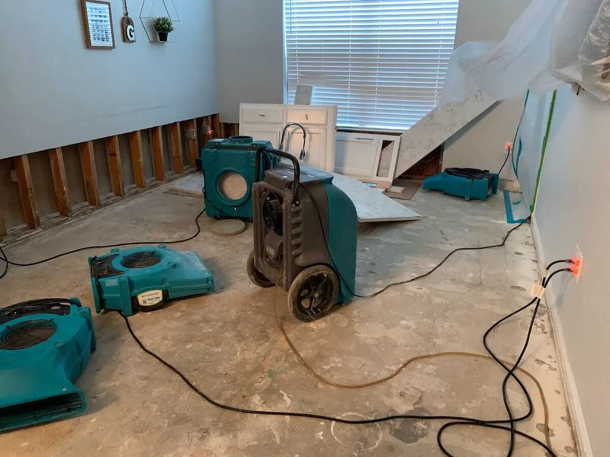 Dehumidifier in flood-cut room for Water Damage Restoration in Moline